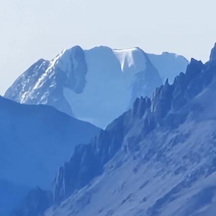  Wedged in the cleft off two peaks.